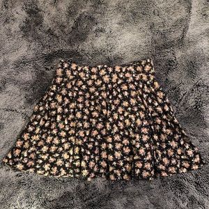 PINS AND NEEDLES • Large black and pink floral skater skirt